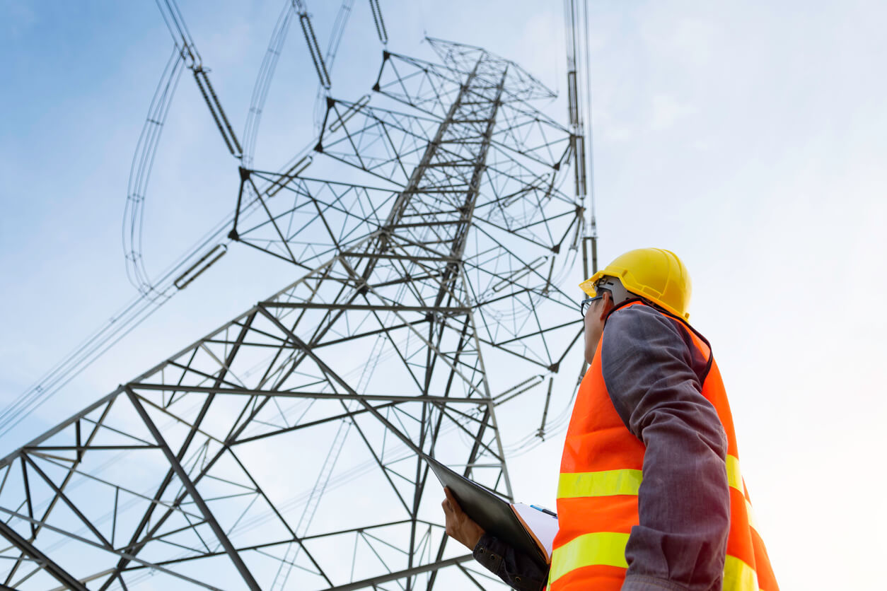 Engineering working on High-voltage tower