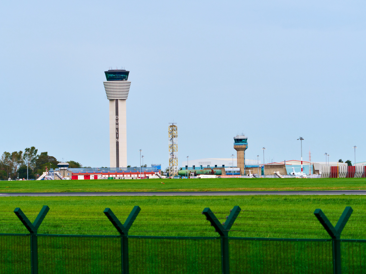 The towering main control tower at Dublin Airport prominently displays the city's name